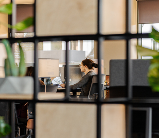 7N female staff member working on her computer in the office